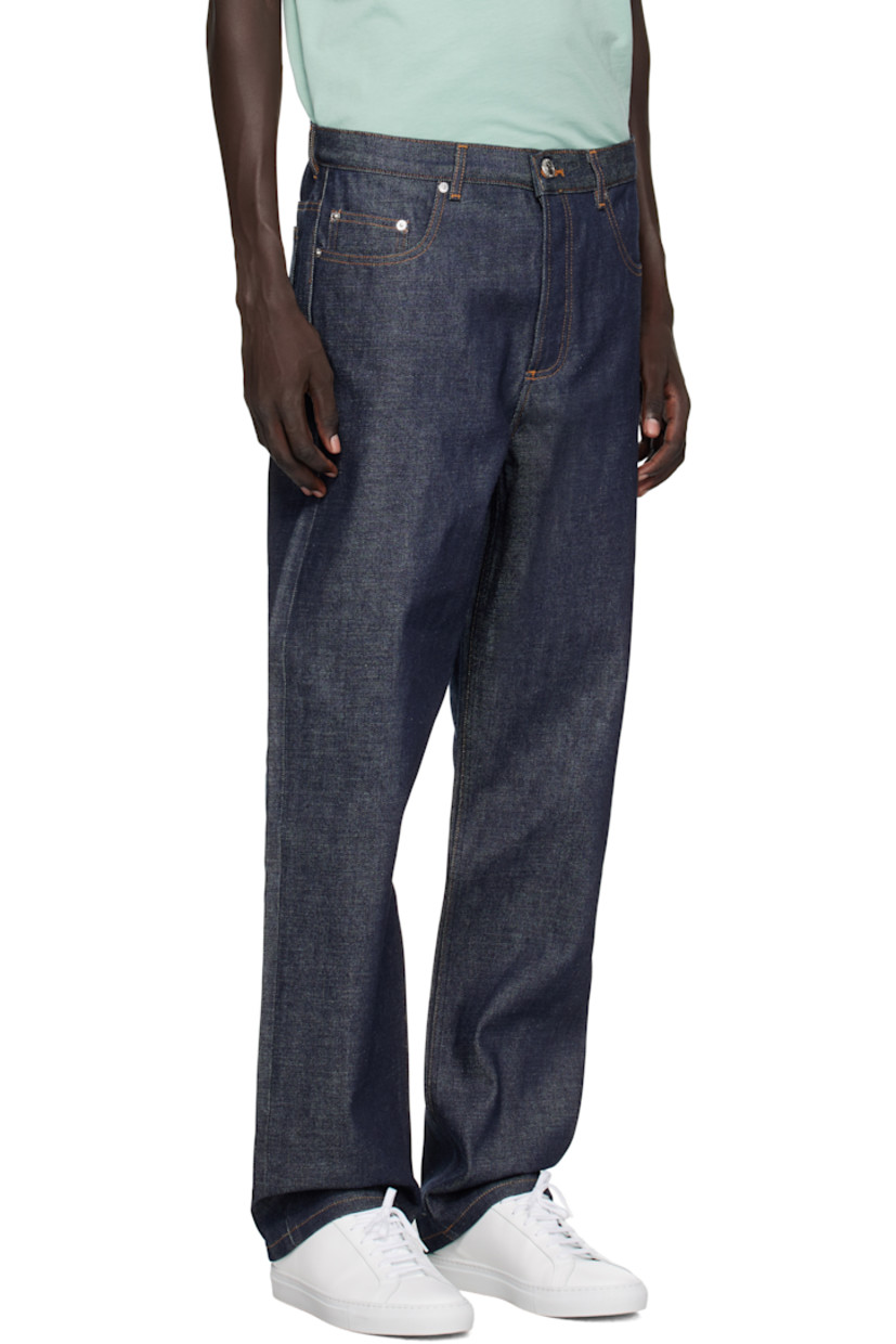 Non-stretch denim jeans.

· Fading throughout
· Wide-leg
· Low rise
· Belt loops
· Five-pocket styling
· Button fly
· Logo-engraved silver-tone hardware
· Contrast stitching in tan

Supplier color: Indigo