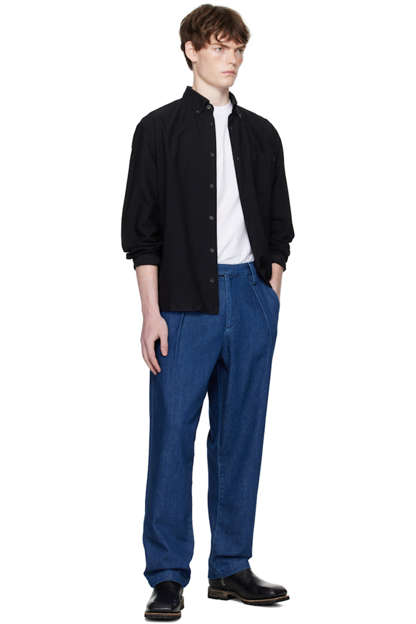 Organic cotton oxford cloth shirt.

· Button-down spread collar
· Button closure
· Logo-embroidered patch pocket at chest
· Shirttail hem
· Buttoned barrel cuffs
· Pleats at back yoke
· Faux-horn hardware

Supplier color: Noir
