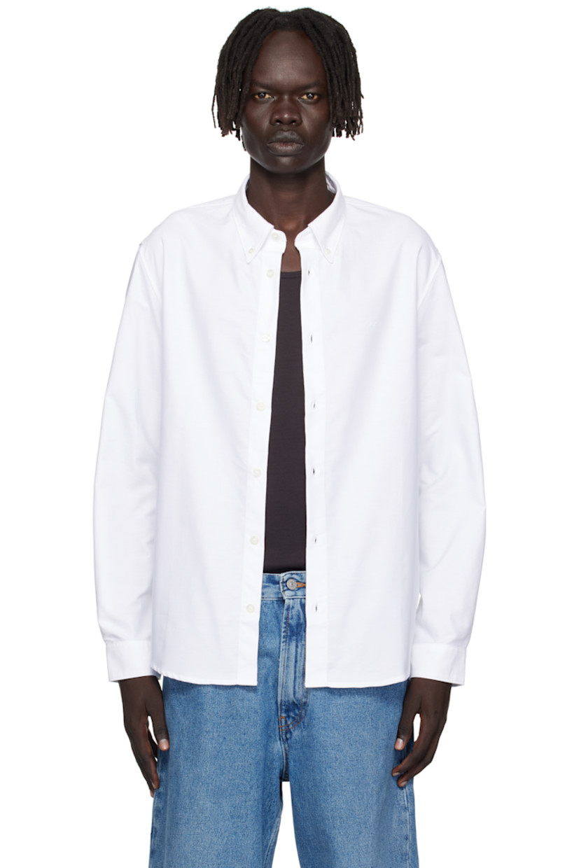 Cotton oxford cloth shirt.

· Button-down spread collar
· Button closure
· Embroidered logo at chest
· Shirttail hem
· Buttoned barrel cuffs

Supplier color: White