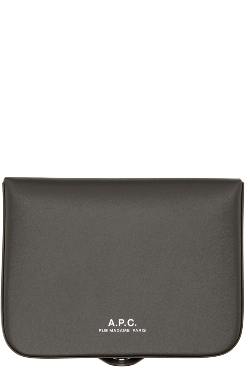 Vegetable-tanned buffed leather wallet.

· Silver-tone logo stamp at face
· Press-stud closure
· Five card slots at interior 
· Coin compartment 
· H3" x W4" x D0.5"

Supplier color: Coal