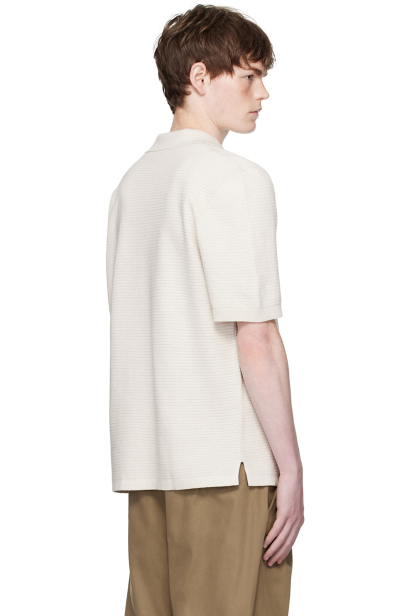Textured knit cotton polo.

· Rib-knit spread collar and cuffs
· Open placket
· Vented side seams

Supplier color: Heathered ecru
