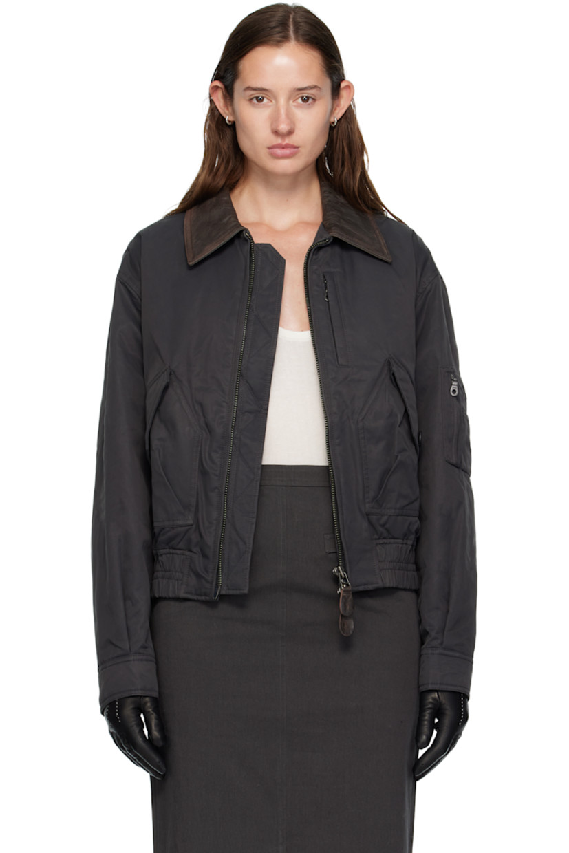 Insulated nylon- and cotton-blend twill jacket. 

· Grained lambskin spread collar 
· Two-way zip closure
· Zip pocket at chest
· Flap pockets at waist 
· Elasticized hem 
· Utility pocket and pen slots at sleeve
· Buttoned cuffs
· Gussets and central seam at back 
· Welt pocket at interior 
· Full satin lining 

Supplier color: Dark greyish green