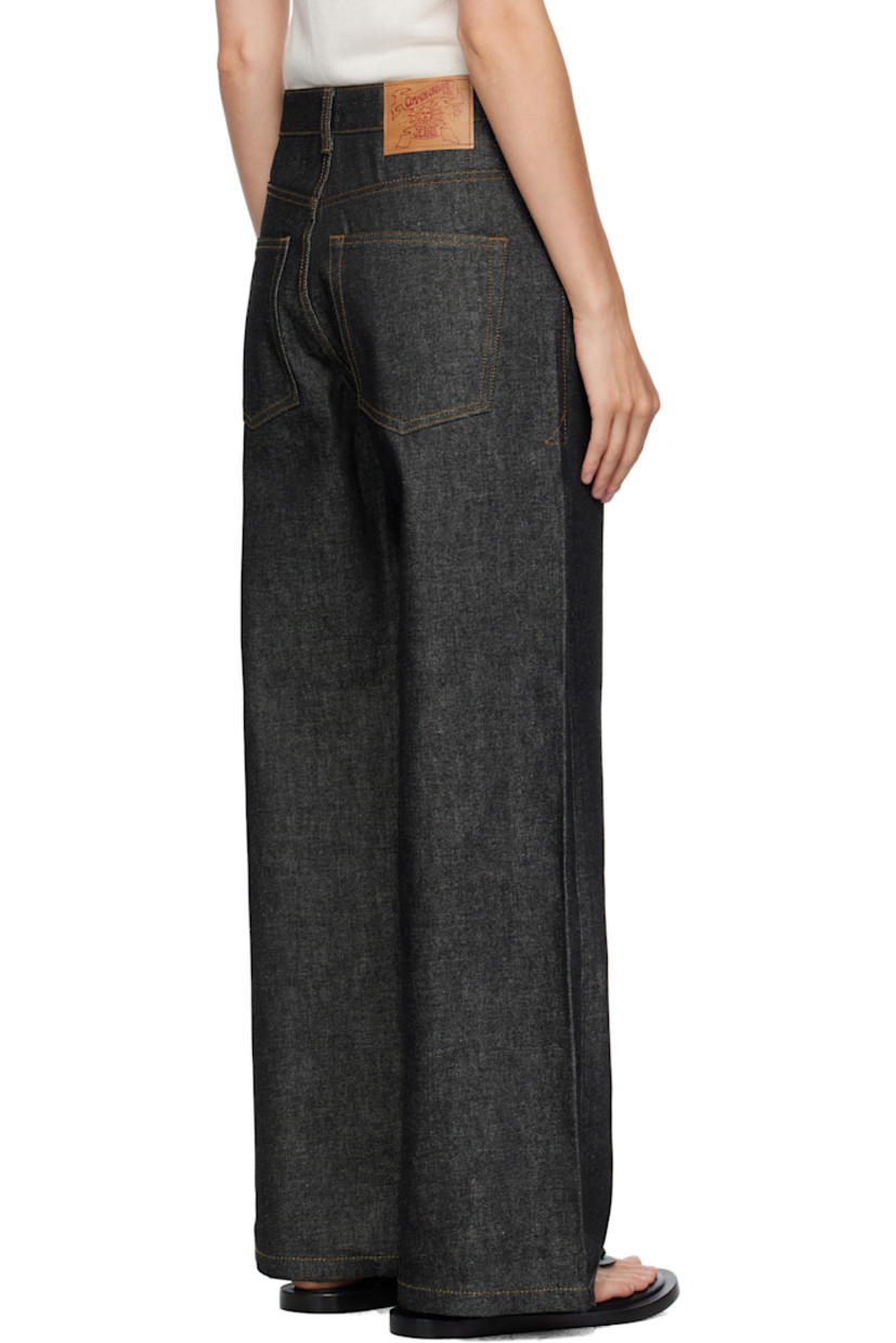 Non-stretch denim jeans. 

· Wide-leg 
· Belt loops
· Five-pocket styling
· Zip fly 
· Logo patch at back waistband
· Contrast stitching in tan 

Supplier color: Indigo