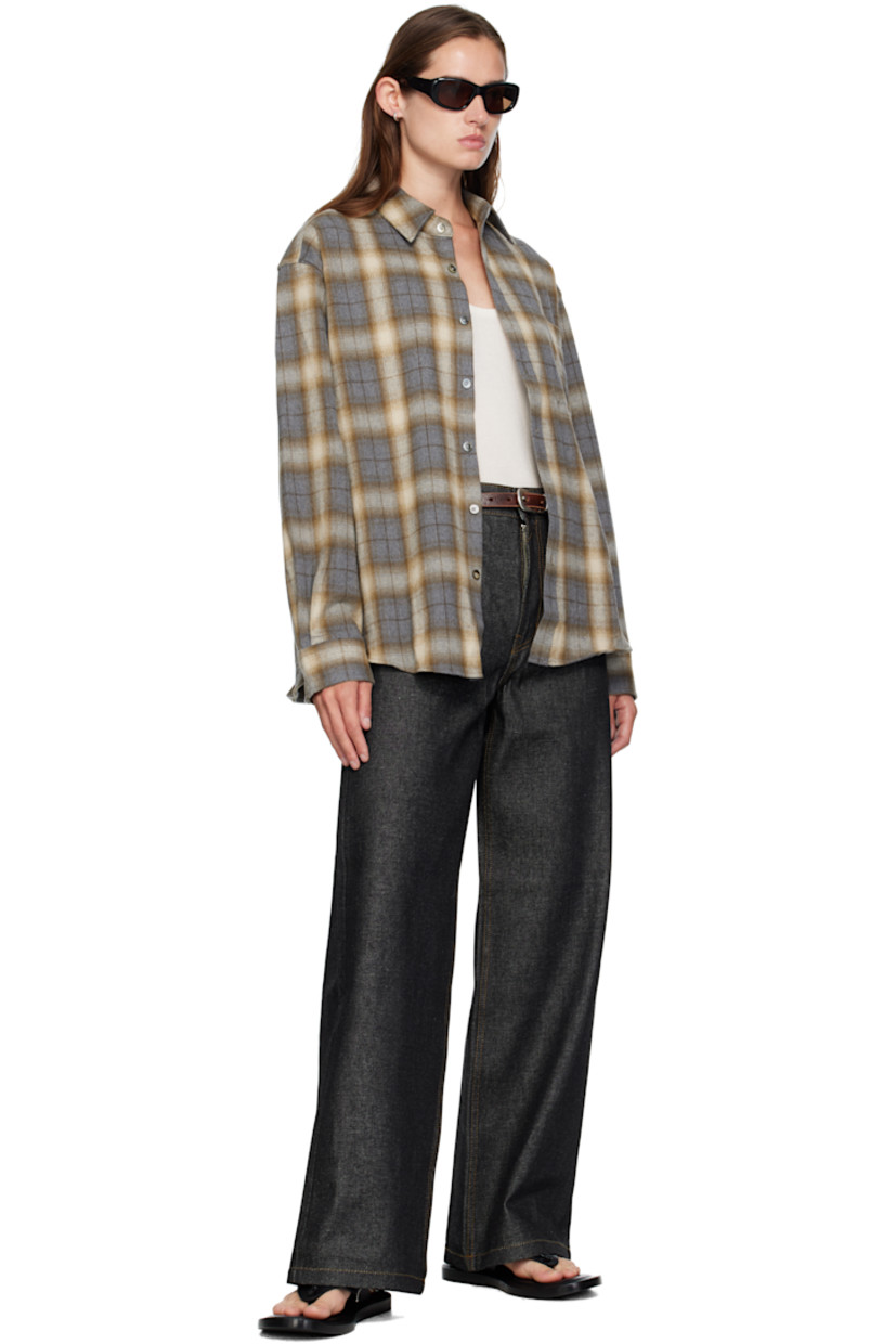 Non-stretch denim jeans. 

· Wide-leg 
· Belt loops
· Five-pocket styling
· Zip fly 
· Logo patch at back waistband
· Contrast stitching in tan 

Supplier color: Indigo