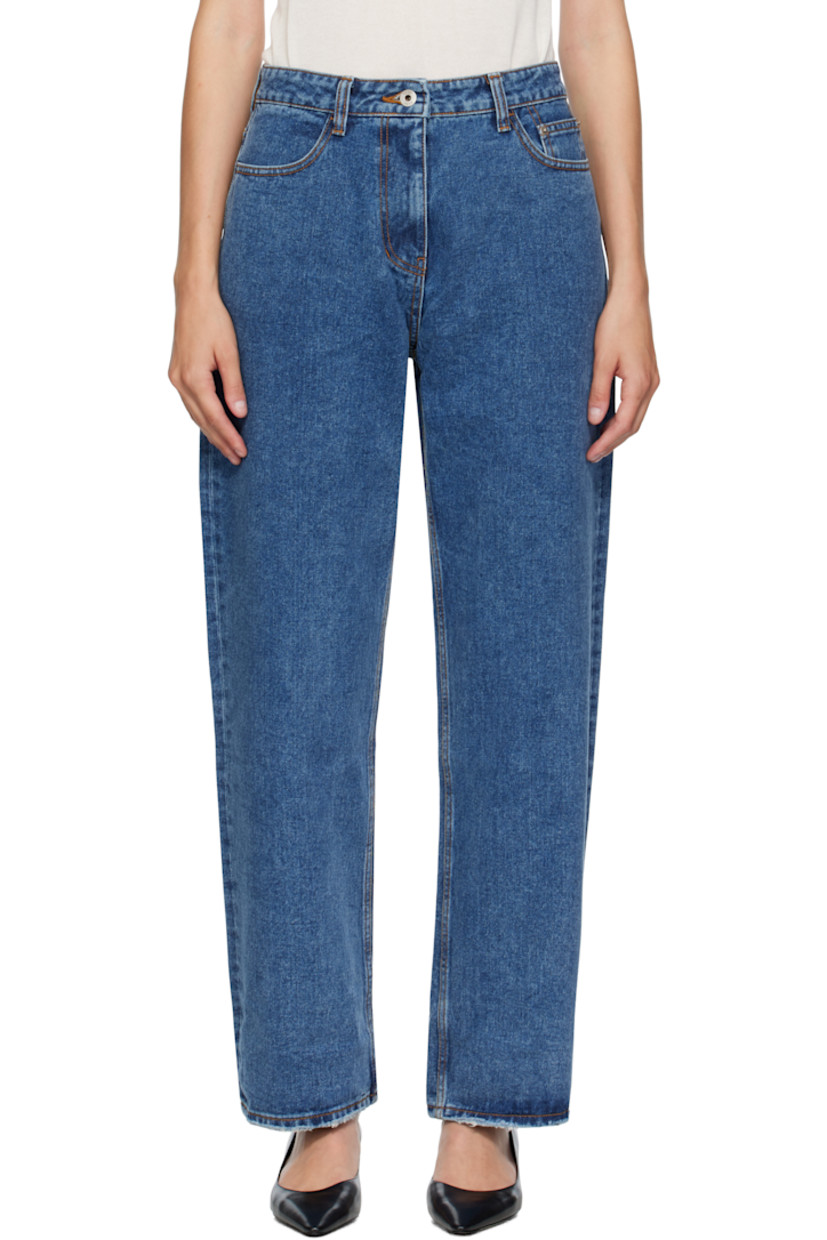 Non-stretch denim jeans. 

· Loose-fit 
· Fading and subtle distressing throughout 
· Belt loops
· Five-pocket styling
· Zip fly 
· Logo patch at back waistband
· Raw edge at cuffs
· Contrast stitching in tan 

Supplier color: Indigo