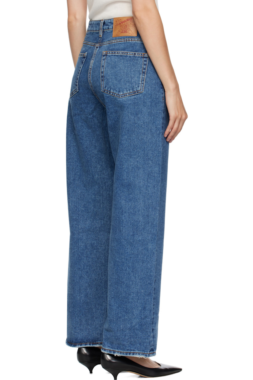 Non-stretch denim jeans. 

· Loose-fit 
· Fading and subtle distressing throughout 
· Belt loops
· Five-pocket styling
· Zip fly 
· Logo patch at back waistband
· Raw edge at cuffs
· Contrast stitching in tan 

Supplier color: Indigo
