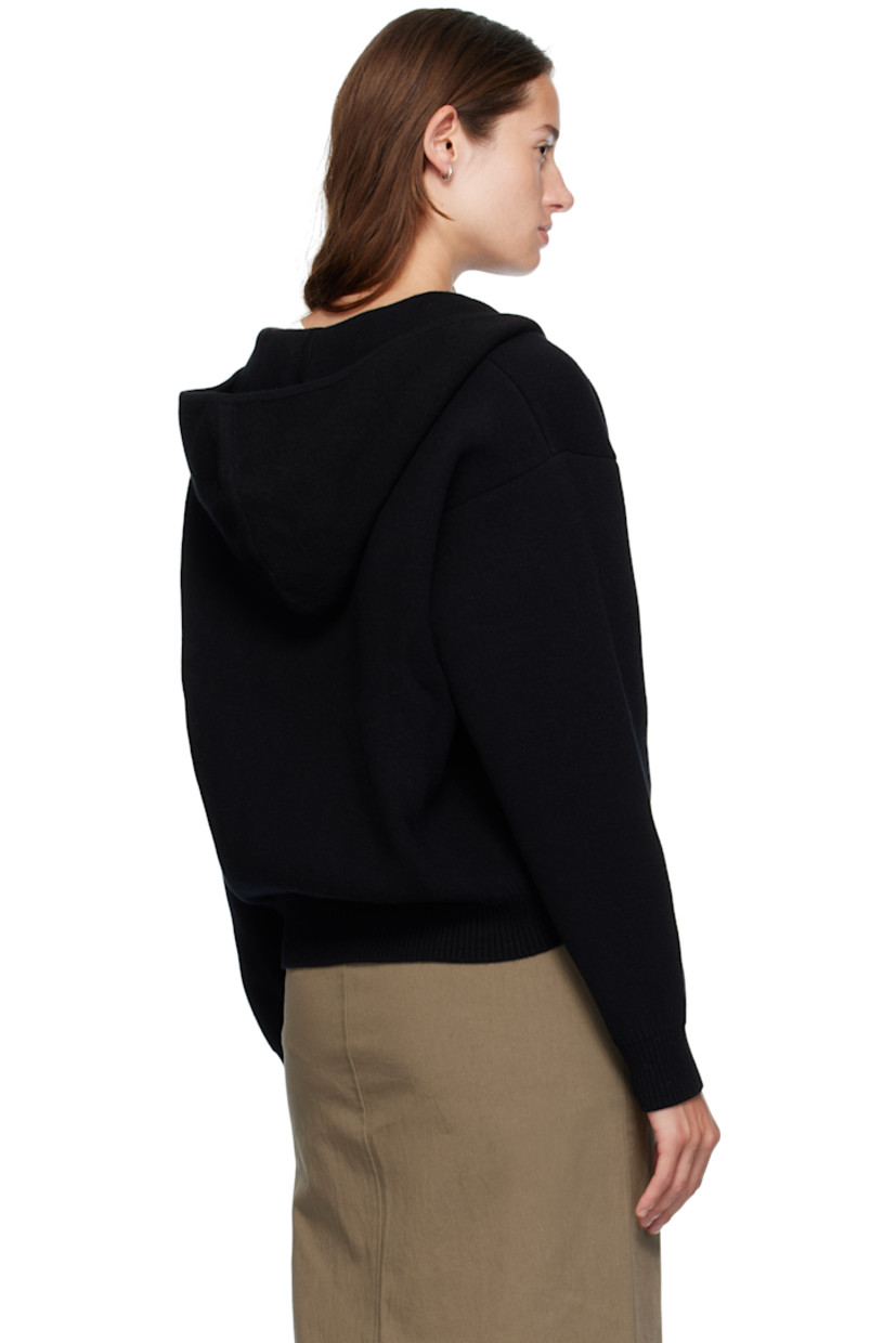 Double-faced knit wool-blend hoodie. 

· Two-way zip closure
· Welt pockets at waist
· Rib-knit hem and cuffs
· Dropped shoulders

Supplier color: Black