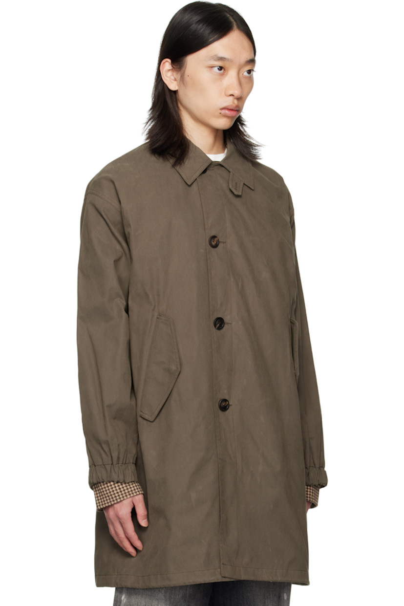 Cotton-blend twill coat.

· Button throat guard at spread collar
· Button closure
· Flap pockets at front
· Adjustable button tab at elasticized cuffs
· Welt pocket and drawstring at interior
· Full satin lining

Supplier color: Khaki