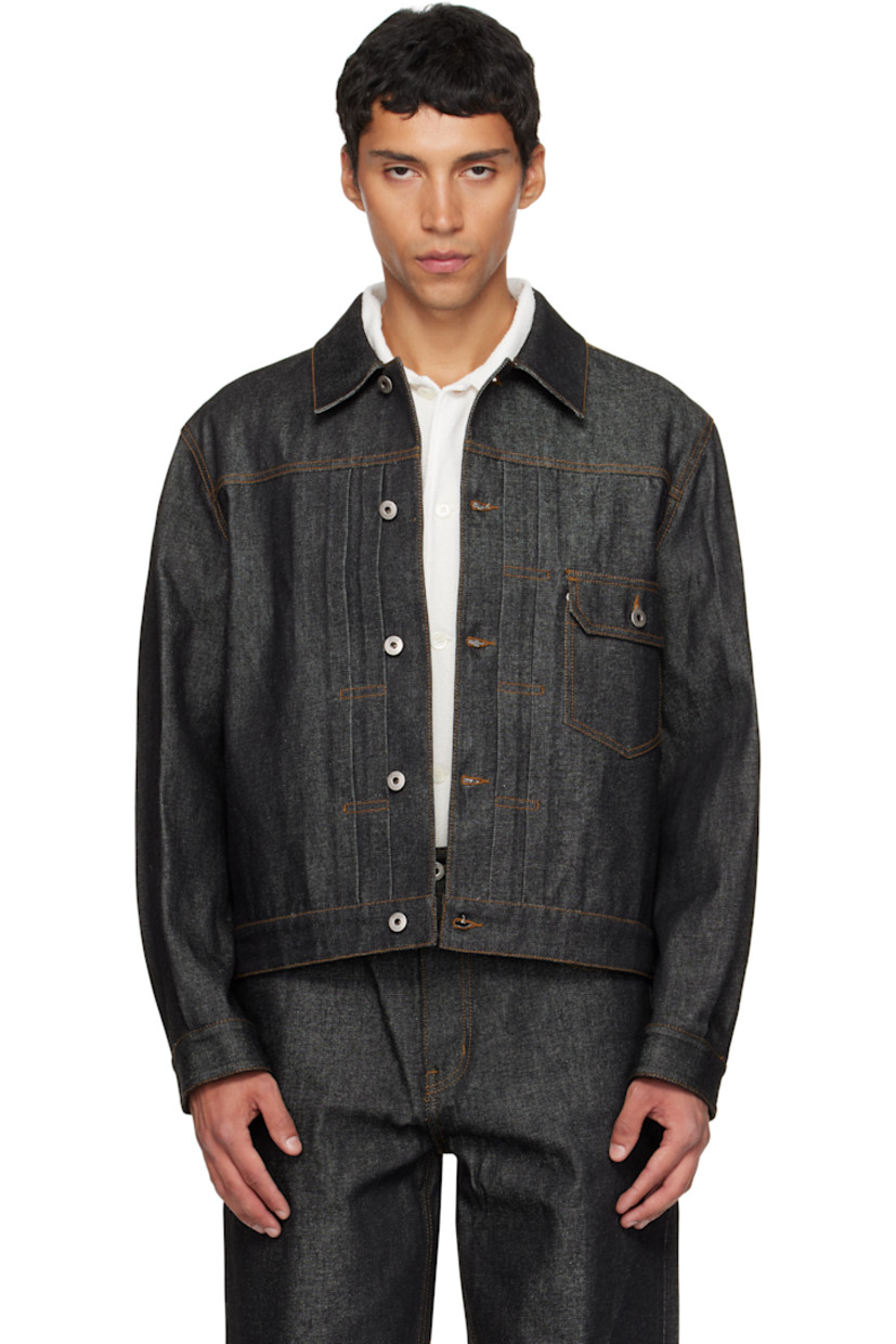 Non-stretch Cone Denim jacket.

· Spread collar
· Button closure
· Tucks at front
· Flap pocket at chest
· Seam pockets
· Adjustable buttoned barrel cuffs
· Adjustable button tabs at back hem
· Contrast stitching in tan

Supplier color: Indigo