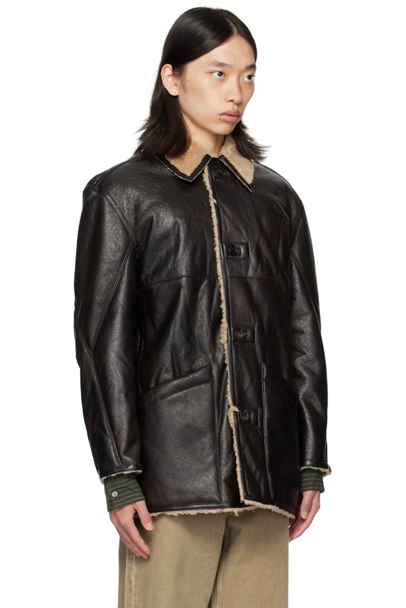 Reversible grained faux-leather coat.

Reverse in beige faux-shearling.

· Spread collar
· Button closure
· Patch pockets at front
· Patch pockets at interior

Supplier color: Dark brown