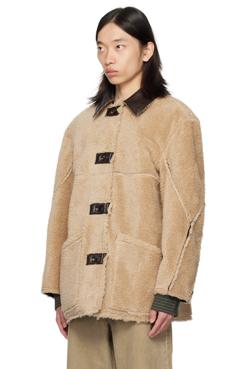 Reversible grained faux-leather coat.

Reverse in beige faux-shearling.

· Spread collar
· Button closure
· Patch pockets at front
· Patch pockets at interior

Supplier color: Dark brown