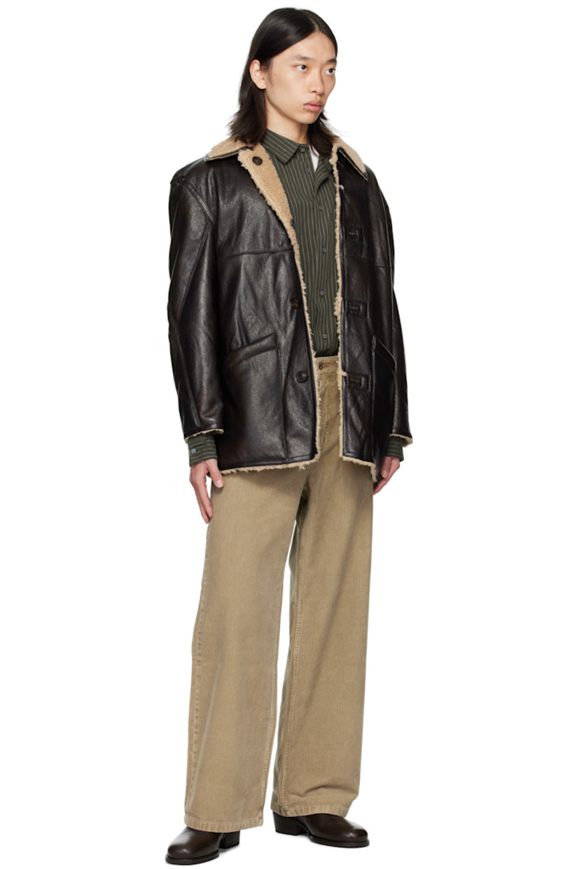 Reversible grained faux-leather coat.

Reverse in beige faux-shearling.

· Spread collar
· Button closure
· Patch pockets at front
· Patch pockets at interior

Supplier color: Dark brown