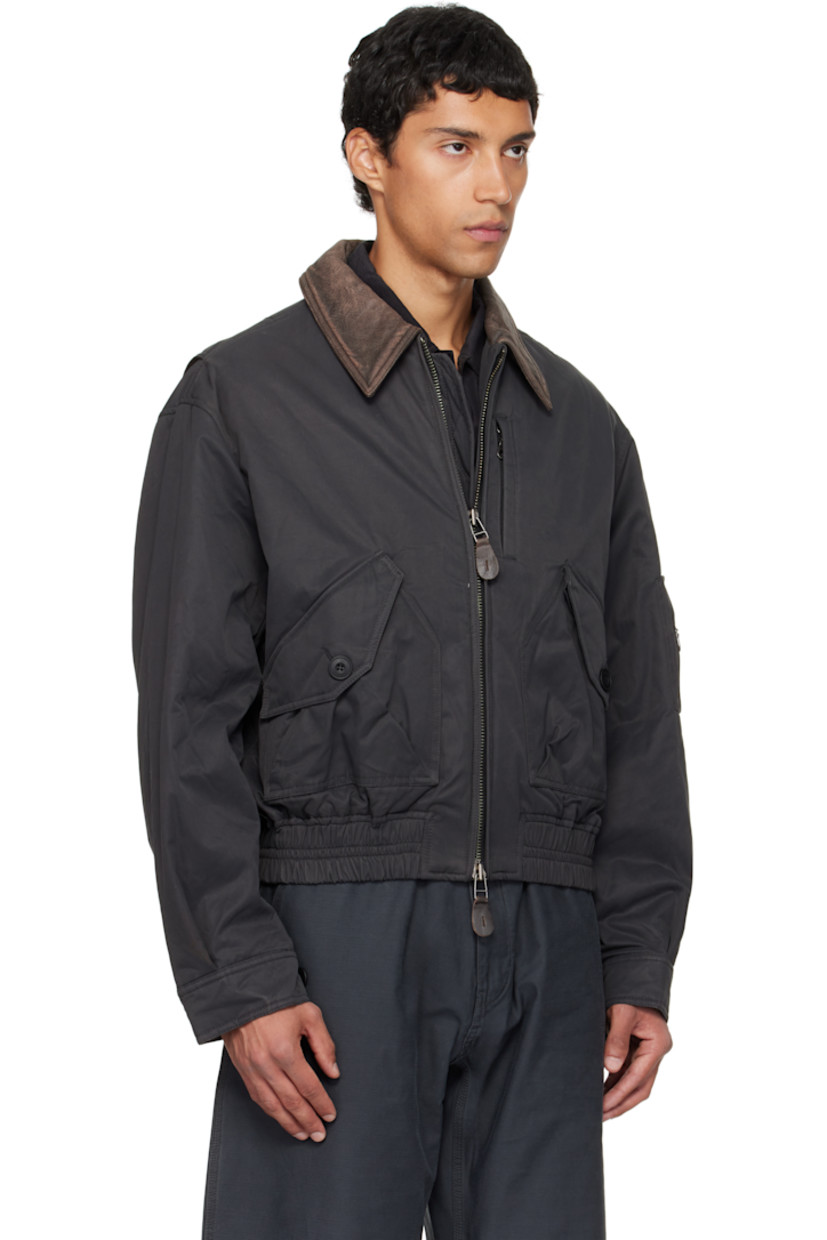 Insulated nylon- and cotton-blend twill jacket.

· Grained lambskin spread collar
· Two-way zip closure
· Flap pockets at front
· Cropped elasticized hem
· Utility pocket at sleeve
· Adjustable buttoned barrel cuffs

Supplier color: Dark grayish green