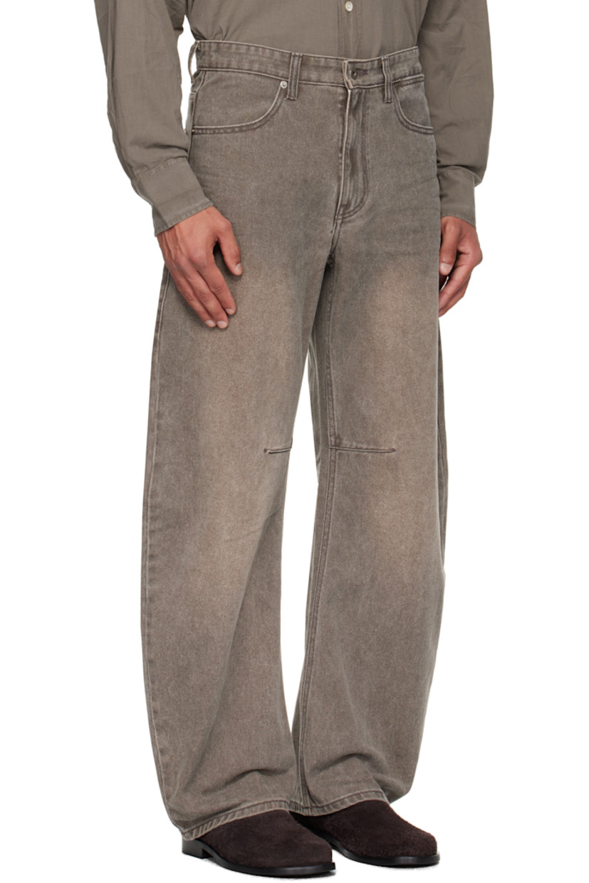 Non-stretch denim jeans.

· Subtle fading throughout
· Belt loops at waistband
· Five-pocket styling
· Zip fly
· Darts at inseam
· Curved legs

Supplier color: Washed brown