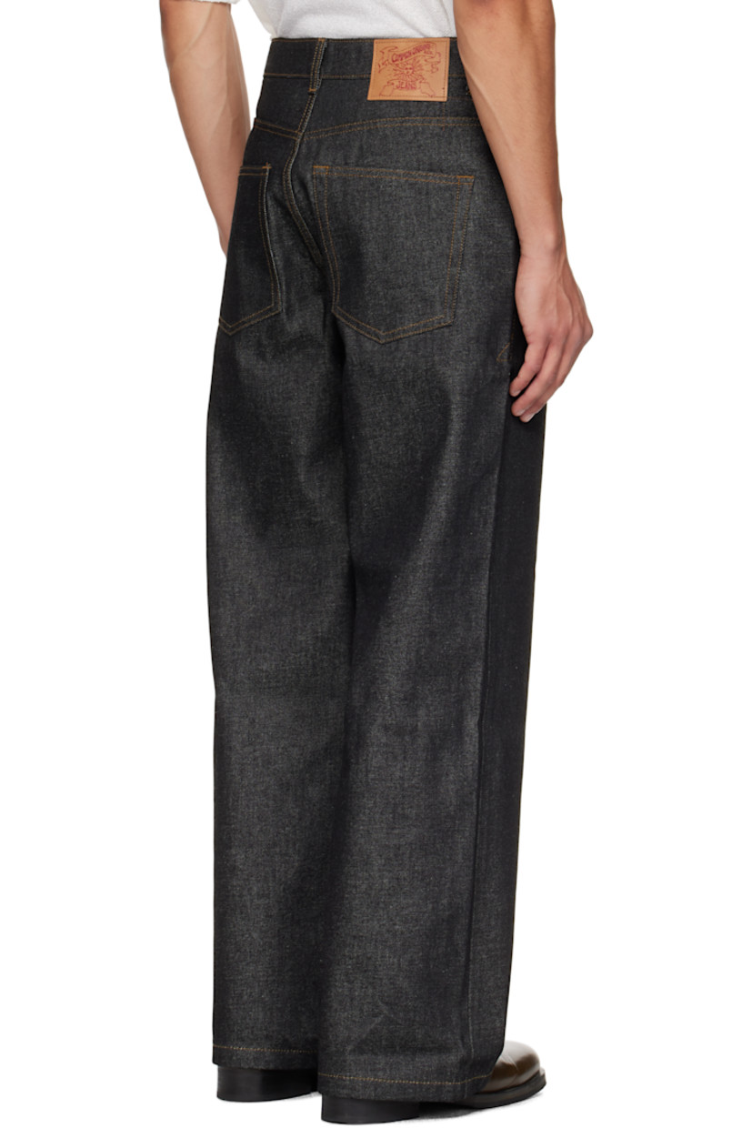 Non-stretch denim jeans.

· Wide-leg
· Belt loops
· Five-pocket styling
· Zip fly
· Logo patch at back waistband
· Contrast stitching in tan

Supplier color: Indigo