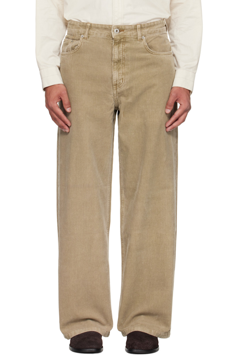 Cotton corduroy trousers.

· Wide-leg
· Belt loops
· Five-pocket styling
· Zip fly
· Logo patch at back waistband
· Contrast stitching in tan

Supplier color: Washed beige