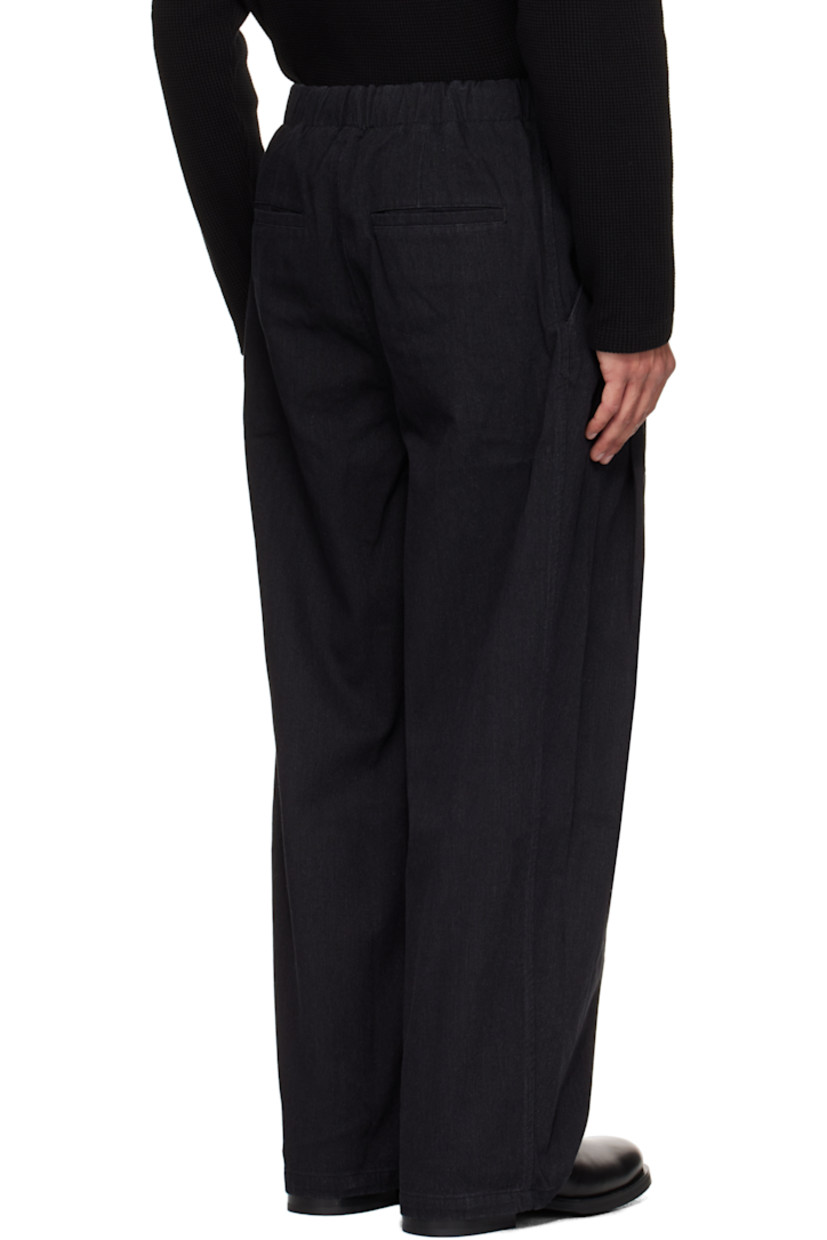Cotton canvas trousers.

· Loose-fit
· Elasticized waistband
· Four-pocket styling
· Zip fly
· Pleats at front

Supplier color: Washed black