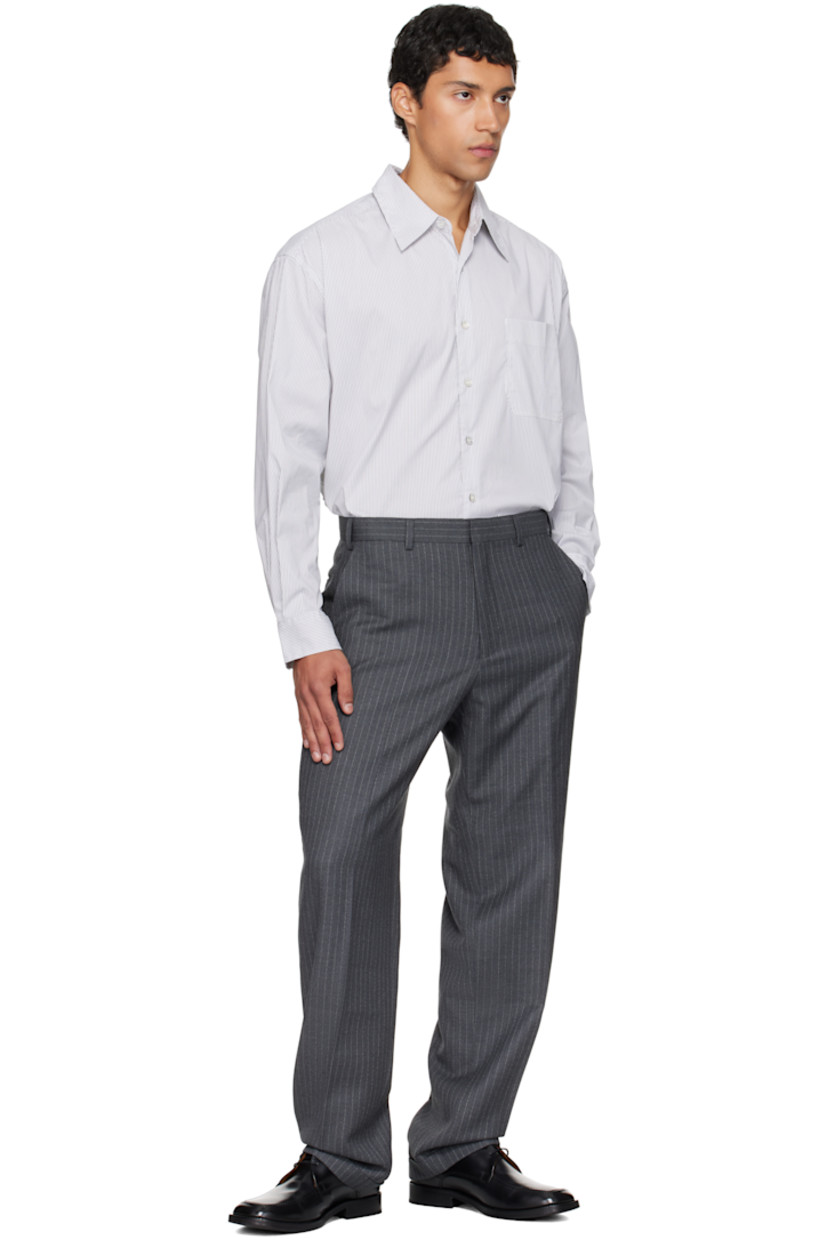 Stretch cotton-blend oxford cloth shirt.

· Stripes throughout
· Spread collar
· Button closure
· Patch pocket at chest
· Shirttail hem
· Buttoned barrel cuffs
· Box pleat at back yoke

Supplier color: White