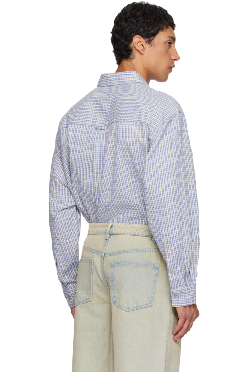 Cotton flannel shirt.

· Check pattern throughout
· Spread collar
· Button closure
· Patch pocket at chest
· Shirttail hem
· Buttoned barrel cuffs
· Locker loop and box pleat at back yoke

Supplier color: Blue check