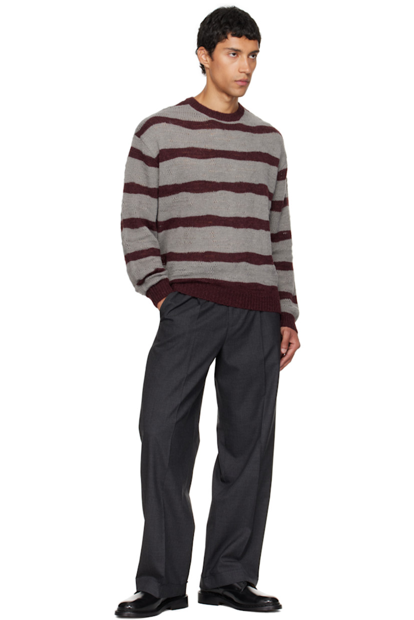 Knit nylon- and wool-blend sweater.

· Stripes throughout
· Rib-knit crewneck, hem, and cuffs
· Dropped shoulders

Supplier color: Grey