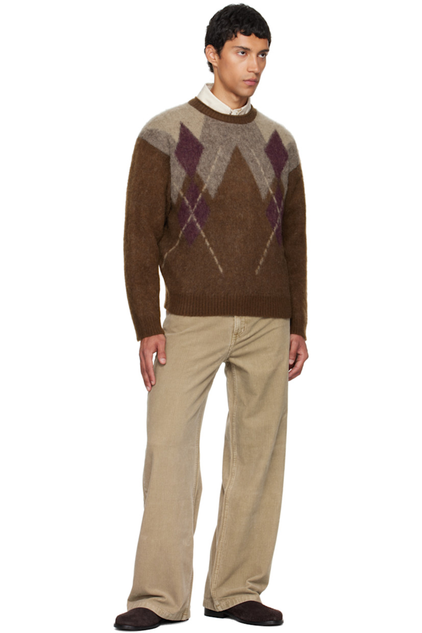 Brushed knit nylon-blend sweater.

· Argyle pattern throughout
· Rib-knit crewneck, hem, and cuffs
· Dropped shoulders

Supplier color: Melange