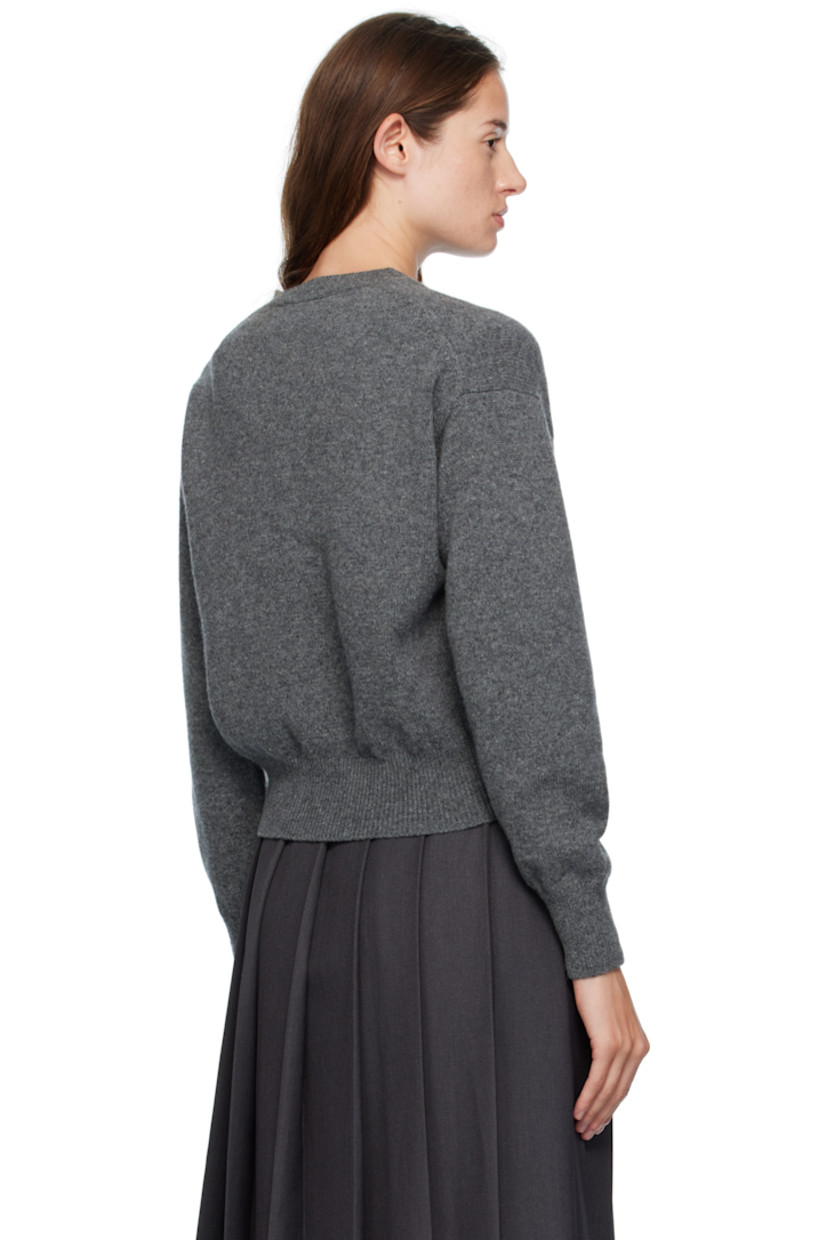 Knit superfine lambswool cardigan.

· Fully fashioned construction
· Rib-knit crewneck, hem, and cuffs
· Button closure
· Dropped shoulders
· Trochus shell hardware

Supplier color: Derby grey