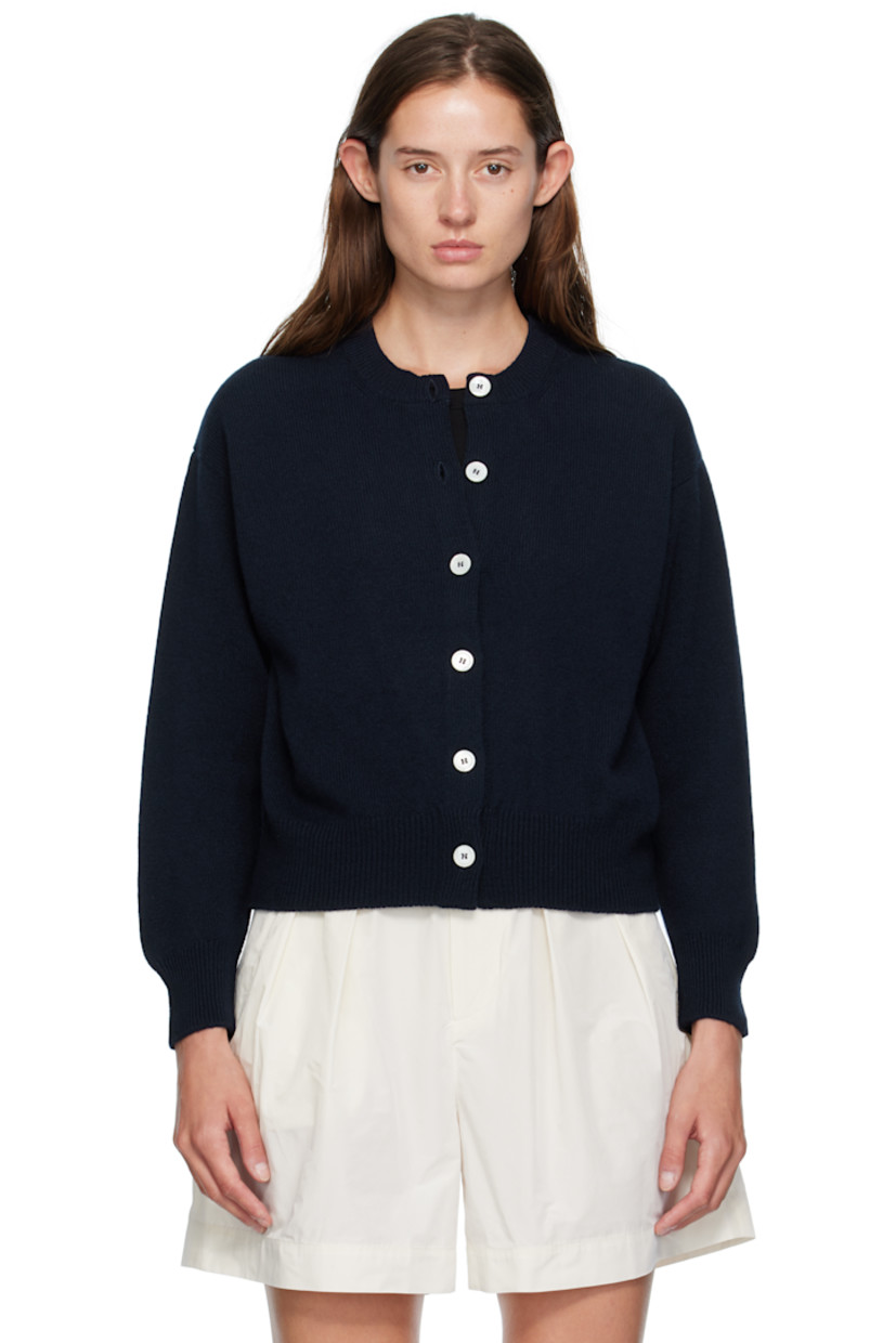 Knit lambswool cardigan.

· Fully fashioned construction
· Rib-knit crewneck, hem, and cuffs
· Button closure
· Dropped shoulders
· Trochus shell hardware

Supplier color: Navy