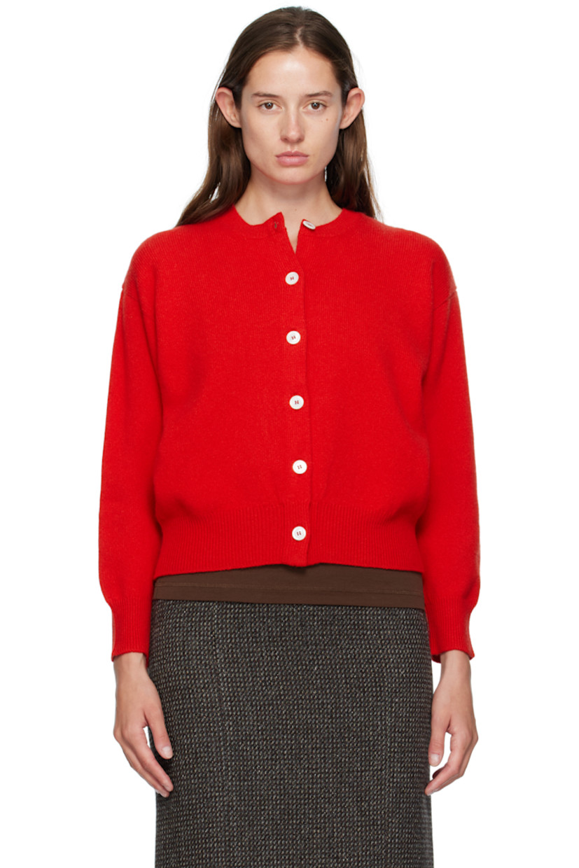 Handcrafted knit Geelong lambswool cardigan. 

· Rib-knit crewneck, hem, and cuffs
· Button closure
· Dropped shoulders

Supplier color: Poppy red