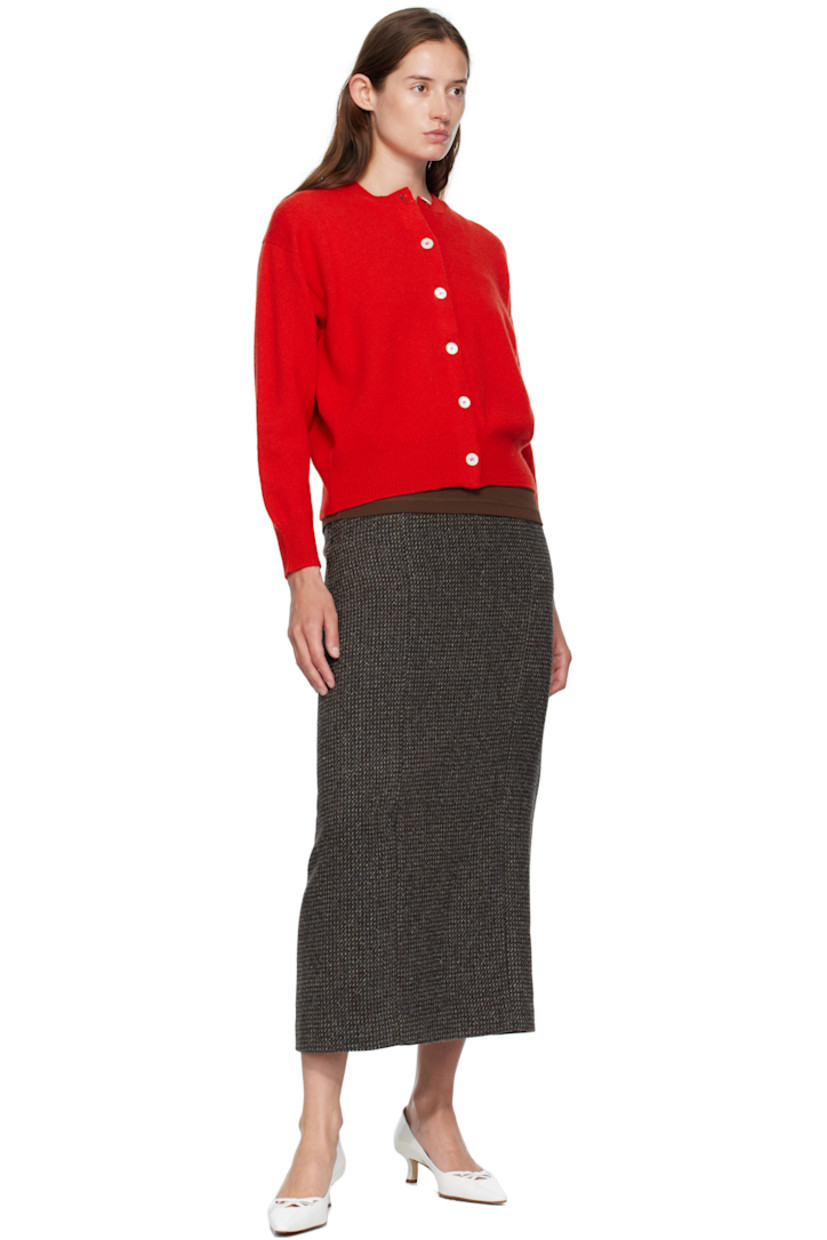 Handcrafted knit Geelong lambswool cardigan. 

· Rib-knit crewneck, hem, and cuffs
· Button closure
· Dropped shoulders

Supplier color: Poppy red