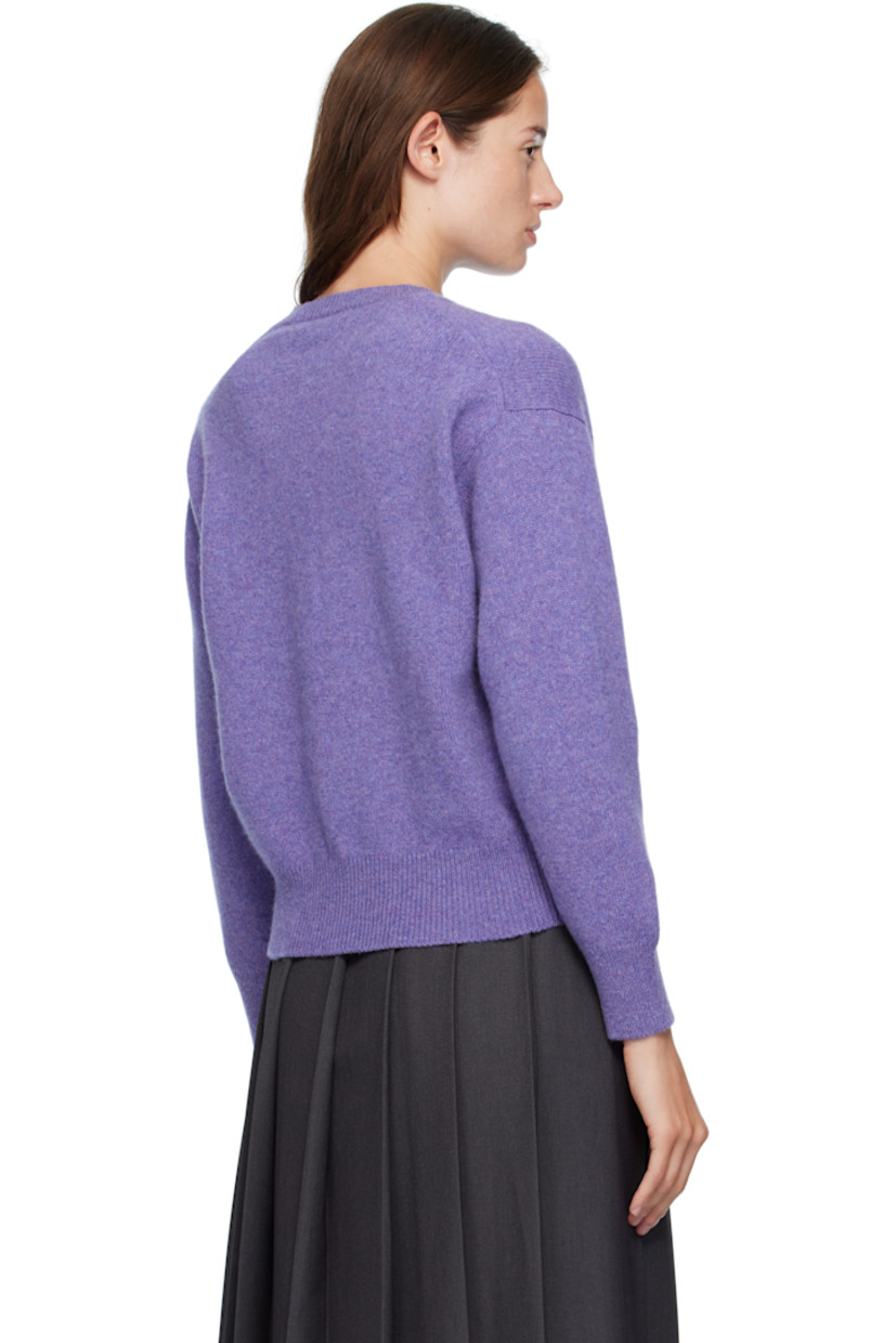 Knit lambswool cardigan.

· Fully fashioned construction
· Rib-knit crewneck, hem, and cuffs
· Button closure
· Dropped shoulders
· Trochus shell hardware

Supplier color: Heather