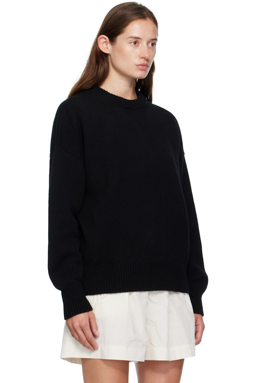 Knit virgin wool sweater.

· RWS-certified virgin wool
· Fully fashioned construction
· Rib-knit crewneck, hem, and cuffs
· Dropped shoulders

Supplier color: Black