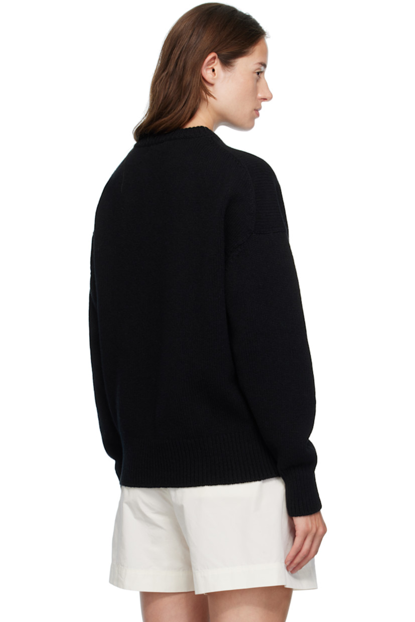 Knit virgin wool sweater.

· RWS-certified virgin wool
· Fully fashioned construction
· Rib-knit crewneck, hem, and cuffs
· Dropped shoulders

Supplier color: Black