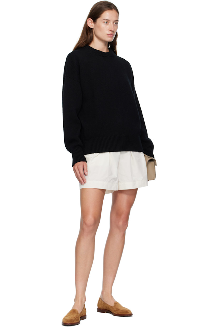 Knit virgin wool sweater.

· RWS-certified virgin wool
· Fully fashioned construction
· Rib-knit crewneck, hem, and cuffs
· Dropped shoulders

Supplier color: Black