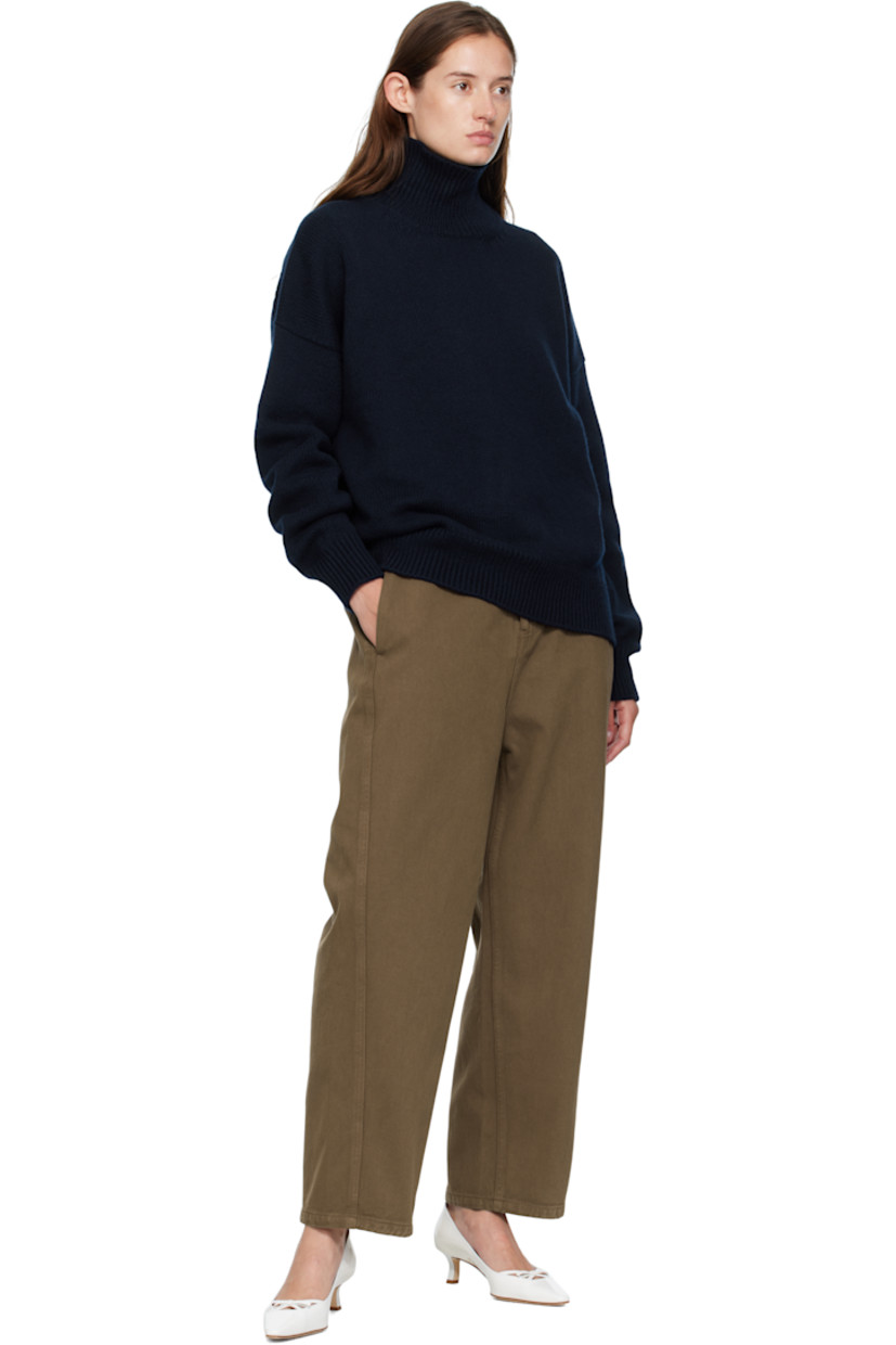 Knit virgin wool turtleneck.

· RWS-certified virgin wool
· Fully fashioned construction
· Rib-knit collar, hem, and cuffs
· Dropped shoulders

Supplier color: Navy