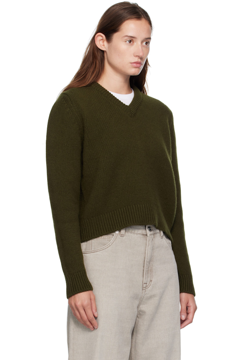 Handcrafted knit Geelong lambswool sweater. Rib-knit V-neck, hem, and cuffs.

Supplier color: Military green