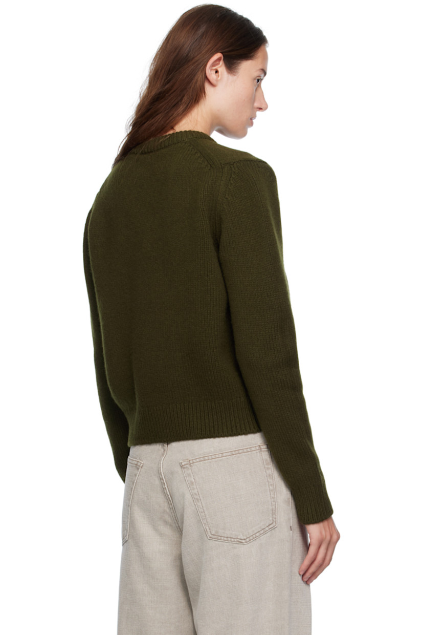 Handcrafted knit Geelong lambswool sweater. Rib-knit V-neck, hem, and cuffs.

Supplier color: Military green