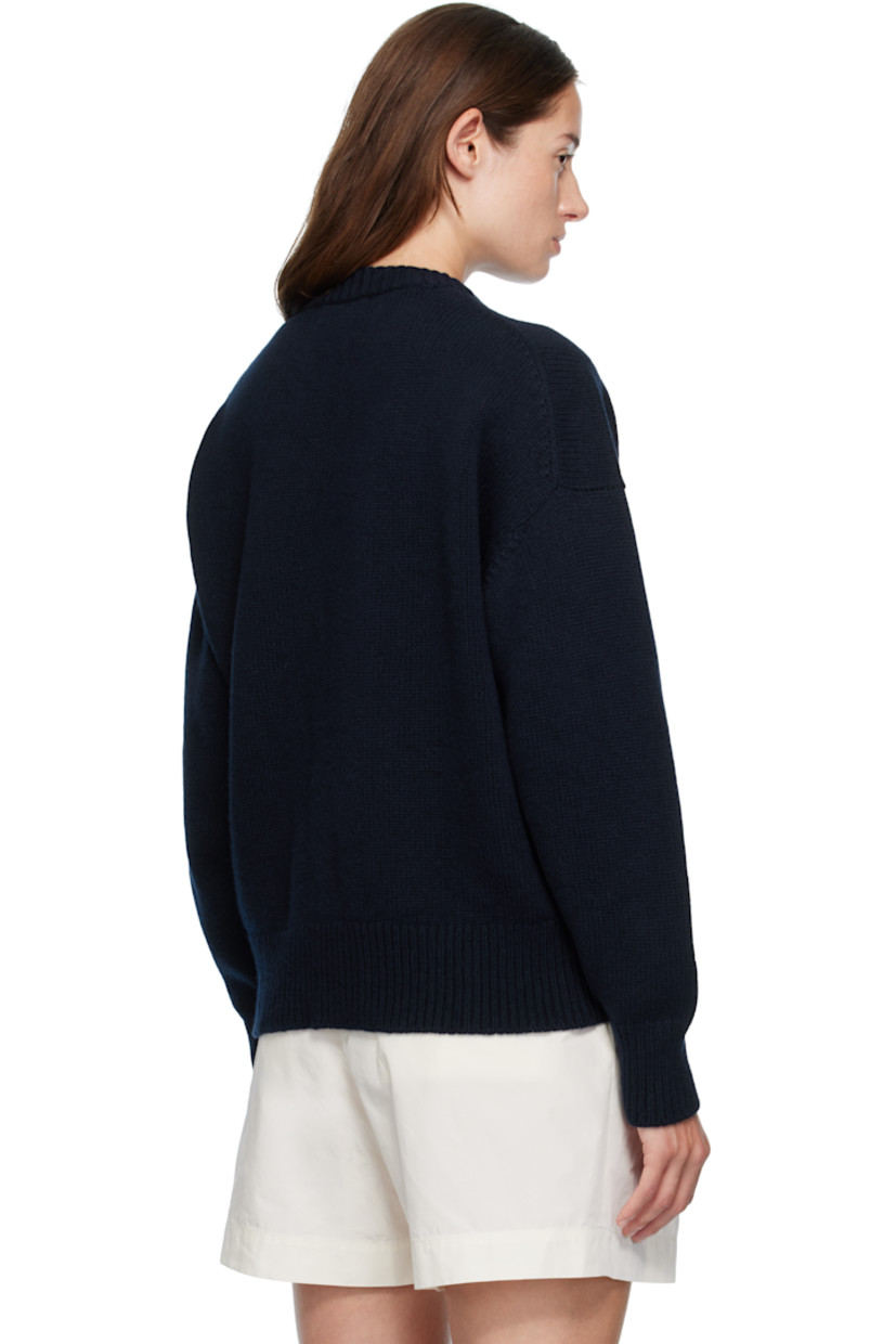 5-gauge knit virgin wool sweater.

· RWS-certified virgin wool
· Fully fashioned construction
· Rib-knit V-neck, hem, and cuffs
· Dropped shoulders

Supplier color: Navy