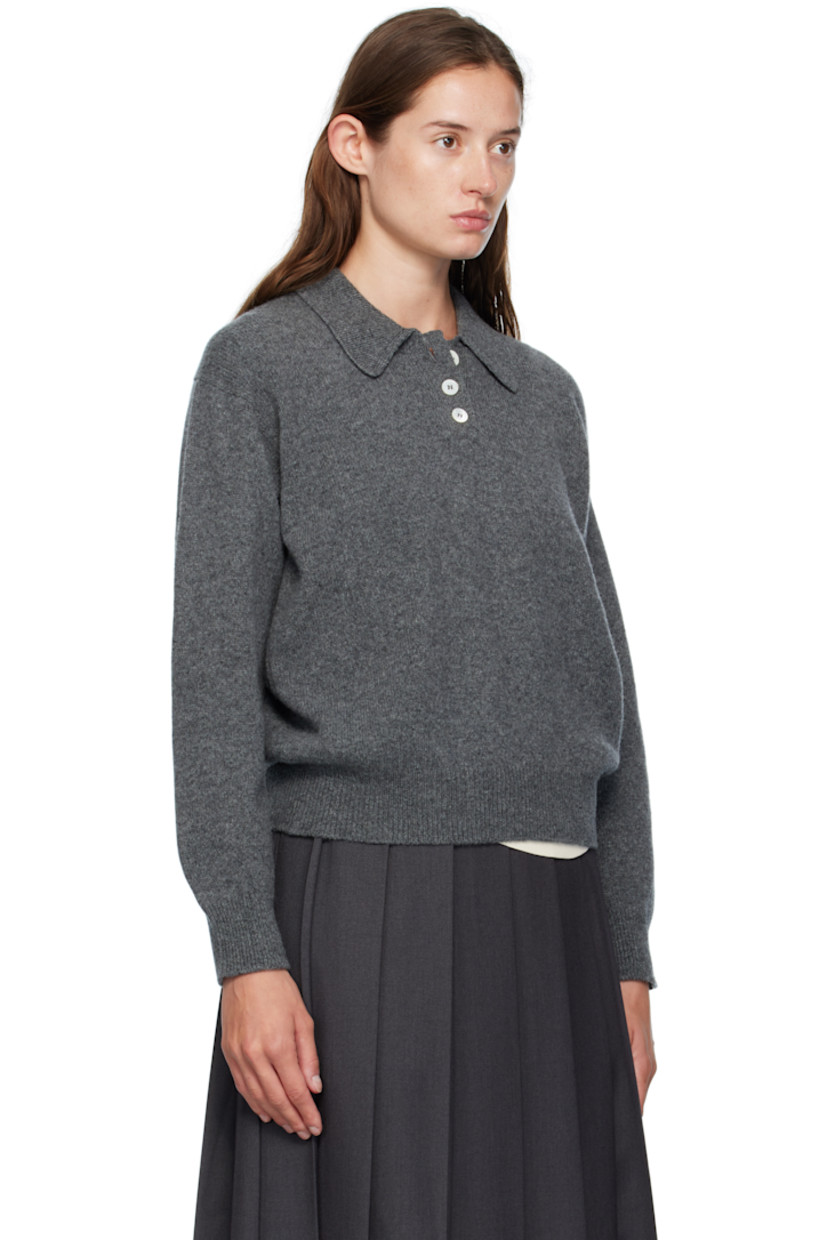 Knit lambswool polo.

· Fully fashioned construction
· Rib-knit spread collar, hem, and cuffs
· Three-button placket
· Dropped shoulders
· Trochus shell hardware

Supplier color: Derby grey