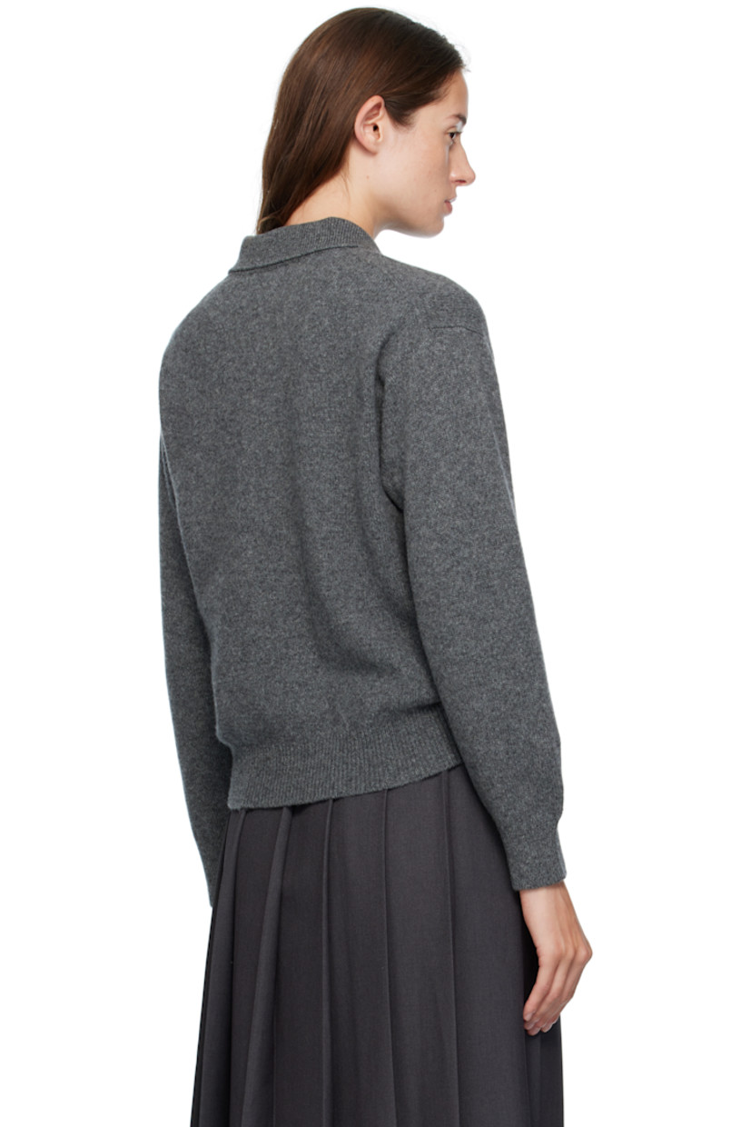 Knit lambswool polo.

· Fully fashioned construction
· Rib-knit spread collar, hem, and cuffs
· Three-button placket
· Dropped shoulders
· Trochus shell hardware

Supplier color: Derby grey