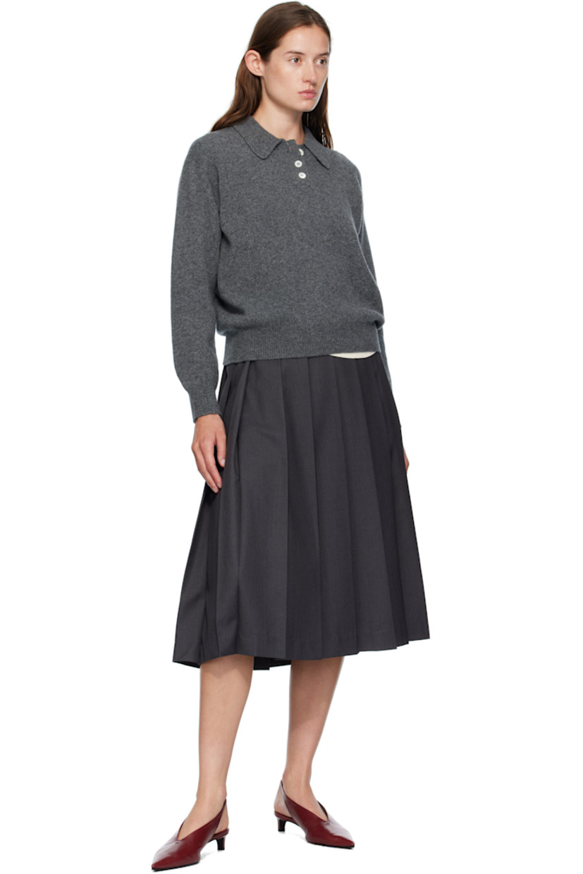 Knit lambswool polo.

· Fully fashioned construction
· Rib-knit spread collar, hem, and cuffs
· Three-button placket
· Dropped shoulders
· Trochus shell hardware

Supplier color: Derby grey