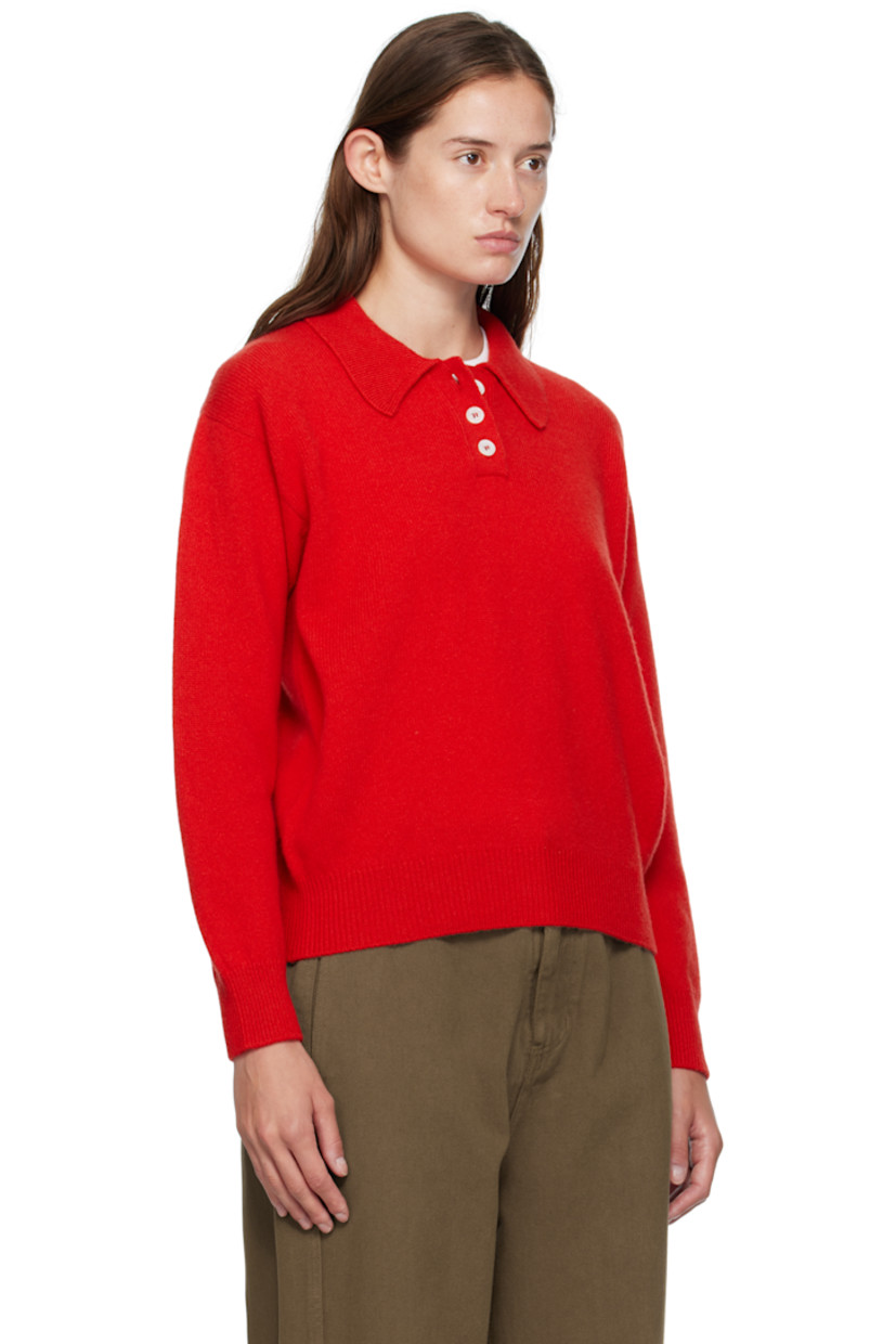 Knit lambswool polo.

· Fully fashioned construction
· Rib-knit spread collar, hem, and cuffs
· Three-button placket
· Dropped shoulders
· Trochus shell hardware

Supplier color: Poppy red