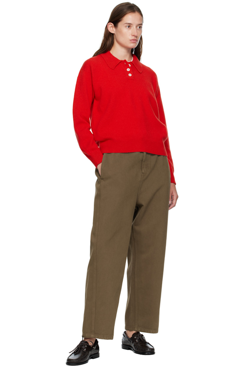 Knit lambswool polo.

· Fully fashioned construction
· Rib-knit spread collar, hem, and cuffs
· Three-button placket
· Dropped shoulders
· Trochus shell hardware

Supplier color: Poppy red