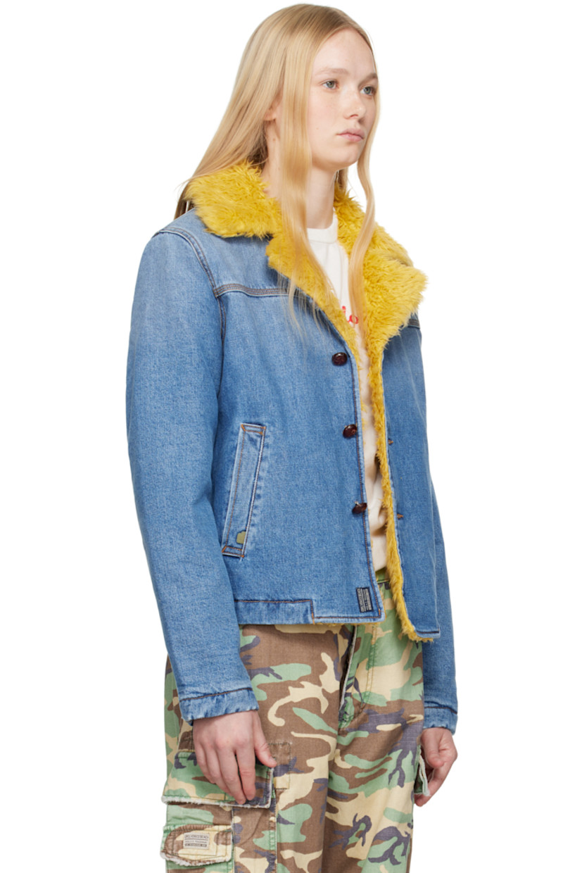 Padded non-stretch denim jacket. Fading throughout.

· Faux-shearling trim at notched lapel
· Button closure
· Welt pockets 
· Full quilted twill lining
· Contrast stitching in tan

Supplier color: Blue