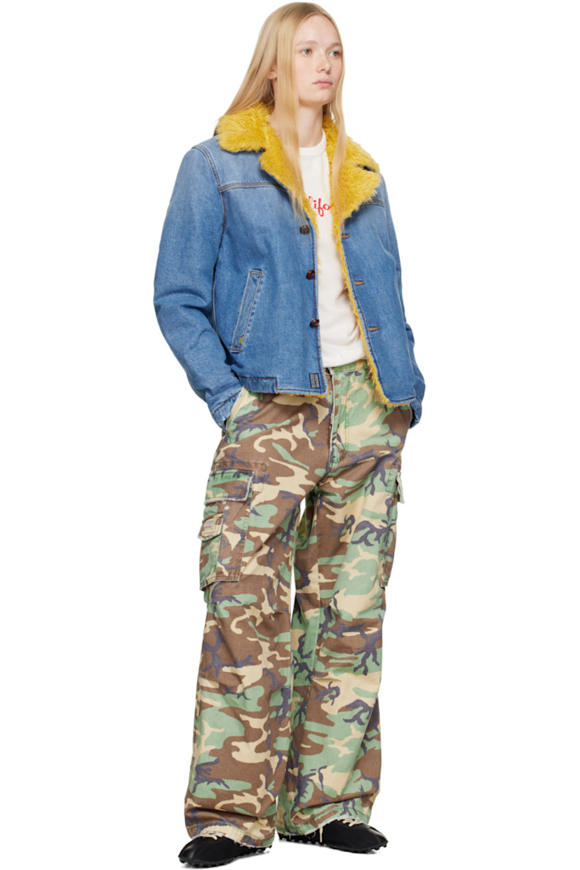 Padded non-stretch denim jacket. Fading throughout.

· Faux-shearling trim at notched lapel
· Button closure
· Welt pockets 
· Full quilted twill lining
· Contrast stitching in tan

Supplier color: Blue