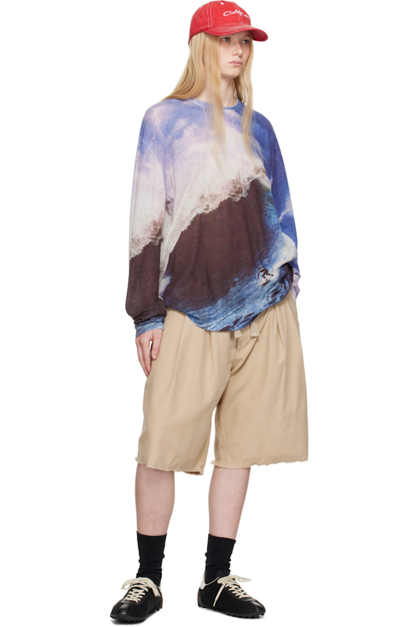 Cotton twill shorts.

· Concealed drawstring and printed text at waistband
· Belt loops
· Four-pocket styling
· Zip fly
· Pleats at front
· Frayed edge at cuffs
· Logo patch at back pocket

Supplier color: Cream