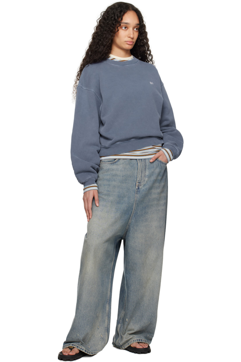 French terry sweatshirt. 

· Rib-knit crewneck, hem, and cuffs
· Embroidered logo patch at chest
· Dropped shoulders

Supplier color: Blue