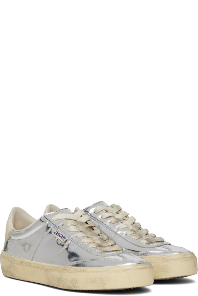 Handcrafted low-top patent leather sneakers in metallic silver tone. 

· Smudging and subtle distressing throughout
· Lace-up closure
· Logo embossed at padded tongue
· Padded collar
· Logo flag and stamp at outer side
· Logo printed at buffed leather heel tab
· Buffed faux-leather and terrycloth lining
· Treaded rubber sole

Supplier color: Silver/Cream