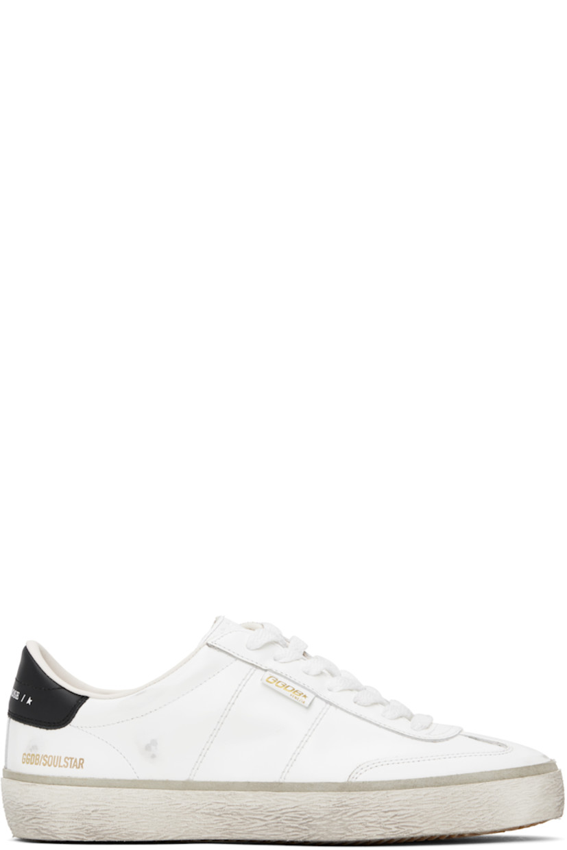 Handcrafted low-top buffed leather sneakers in white. 

· Smudging throughout
· Lace-up closure
· Logo stamp and star embossed at padded tongue
· Padded collar 
· Logo stamp at vamp 
· Logo stamp at outer side and heel tab 
· Terrycloth lining 
· Treaded rubber sole 

Supplier color: White/Black