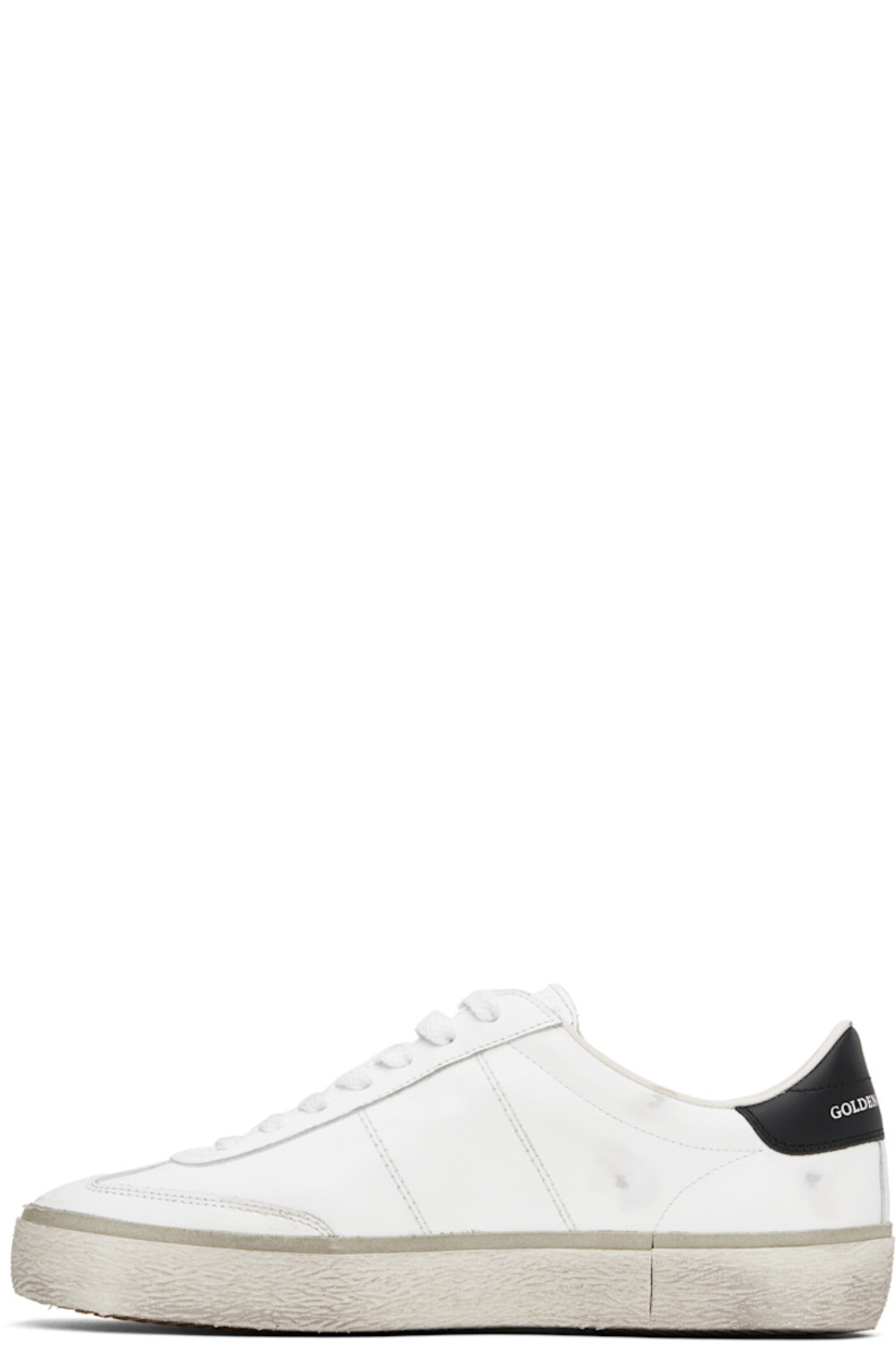 Handcrafted low-top buffed leather sneakers in white. 

· Smudging throughout
· Lace-up closure
· Logo stamp and star embossed at padded tongue
· Padded collar 
· Logo stamp at vamp 
· Logo stamp at outer side and heel tab 
· Terrycloth lining 
· Treaded rubber sole 

Supplier color: White/Black