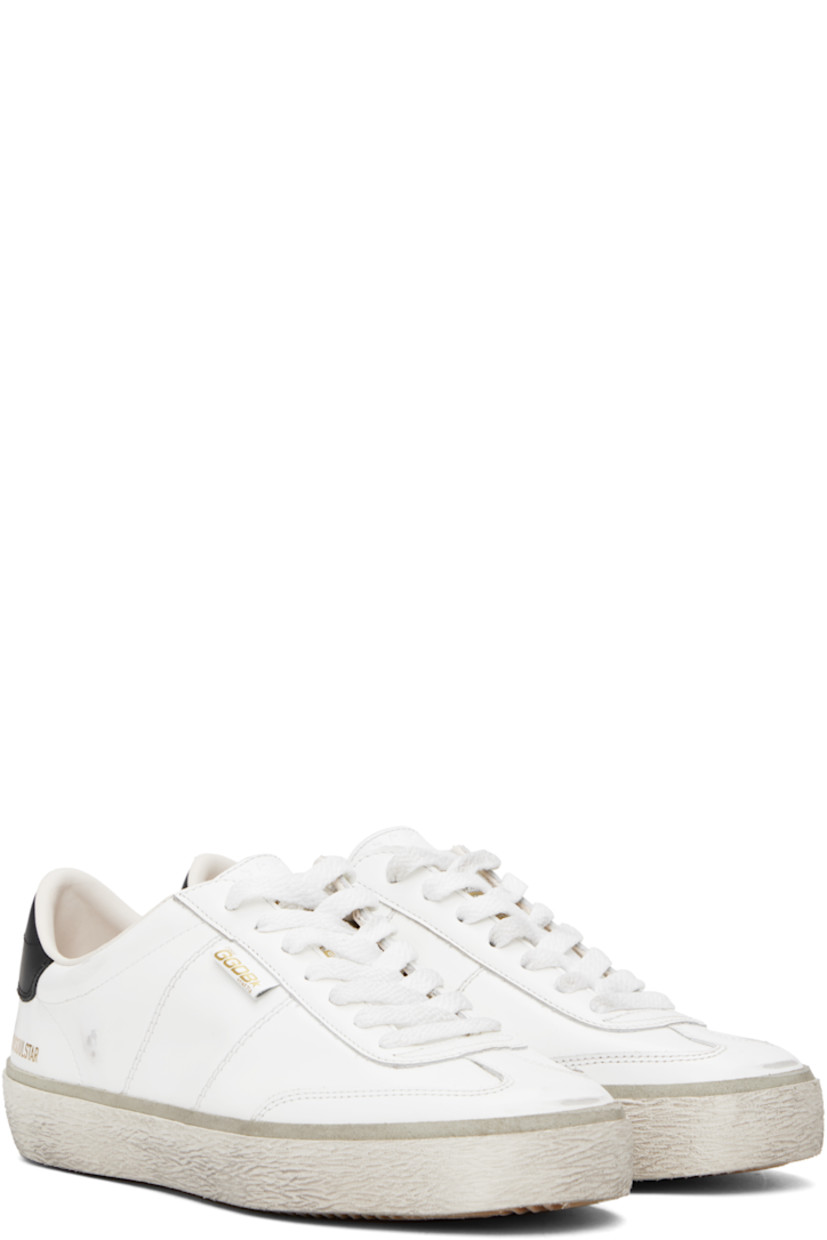 Handcrafted low-top buffed leather sneakers in white. 

· Smudging throughout
· Lace-up closure
· Logo stamp and star embossed at padded tongue
· Padded collar 
· Logo stamp at vamp 
· Logo stamp at outer side and heel tab 
· Terrycloth lining 
· Treaded rubber sole 

Supplier color: White/Black
